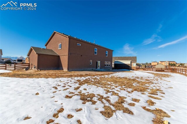 10978 Middlegate Ct, Peyton, CO 80831 - snow covered property featuring stucco siding