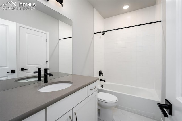 full bathroom with tile patterned flooring, vanity, shower / bathtub combination, and toilet