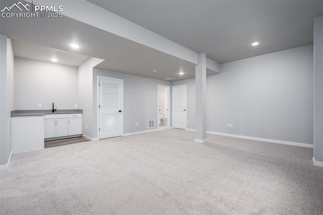 basement with light colored carpet