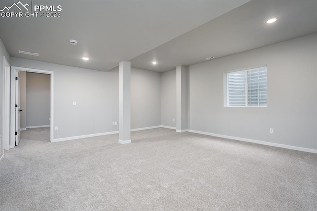 basement featuring light colored carpet