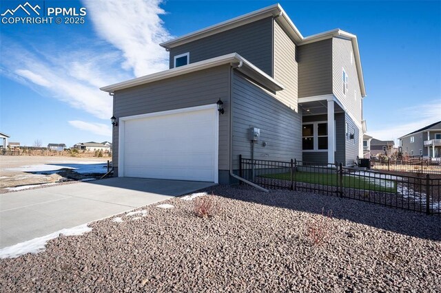 view of side of home with a garage