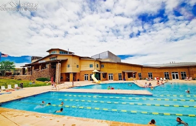 view of swimming pool featuring a patio area