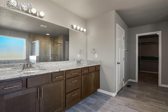 bathroom featuring vanity and walk in shower