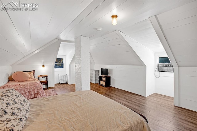 bedroom with wooden ceiling, hardwood / wood-style flooring, and lofted ceiling