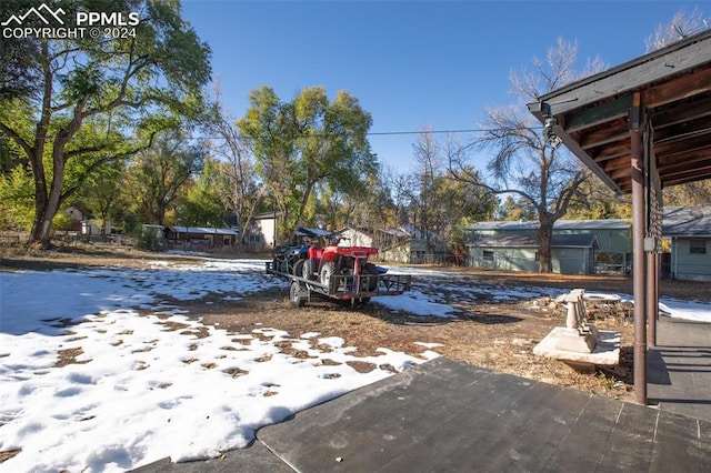 view of yard covered in snow