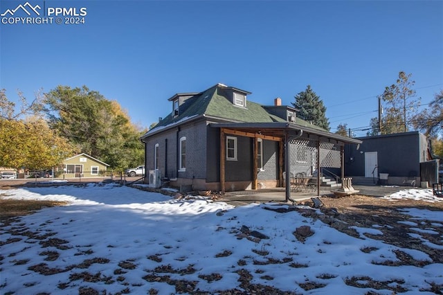 view of snow covered house