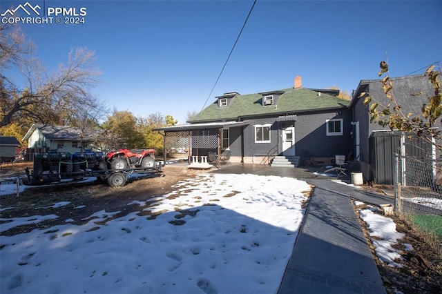 back of house with a patio