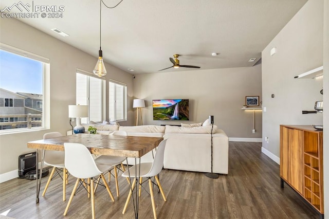 dining area with dark hardwood / wood-style flooring and ceiling fan