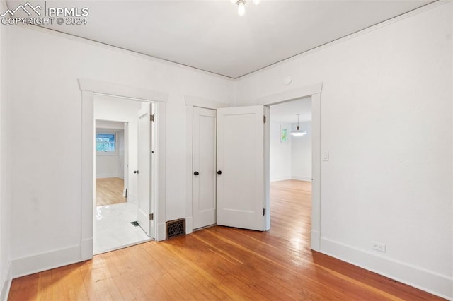 unfurnished bedroom featuring wood-type flooring