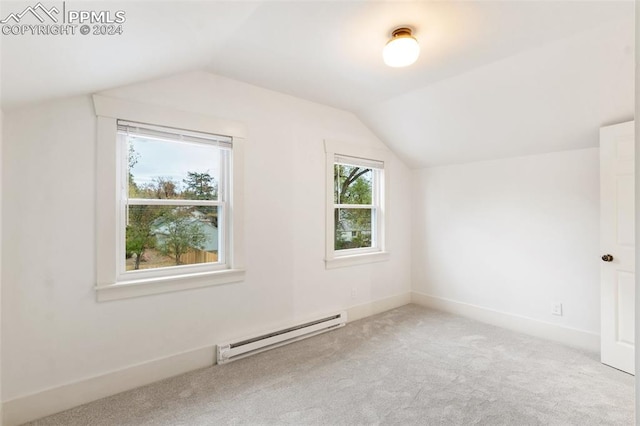 bonus room with baseboard heating, lofted ceiling, and light carpet