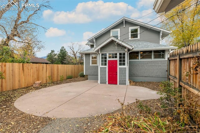 rear view of property featuring a patio area