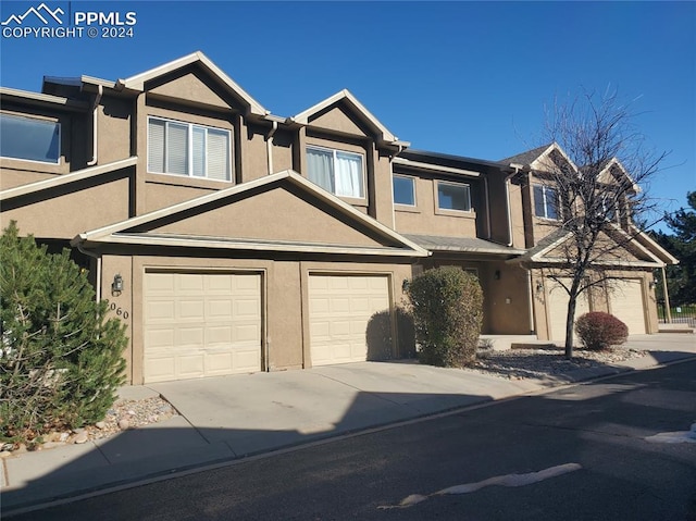 townhome / multi-family property featuring a garage