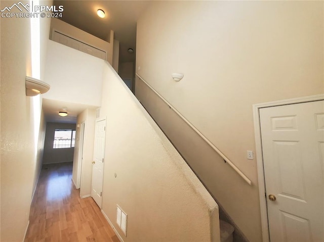 stairway featuring wood-type flooring