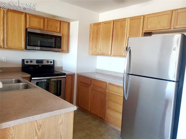 kitchen featuring appliances with stainless steel finishes and sink