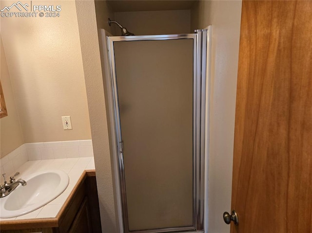 bathroom featuring vanity and walk in shower