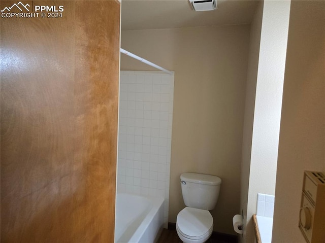 full bathroom featuring vanity, toilet, and tiled shower / bath combo