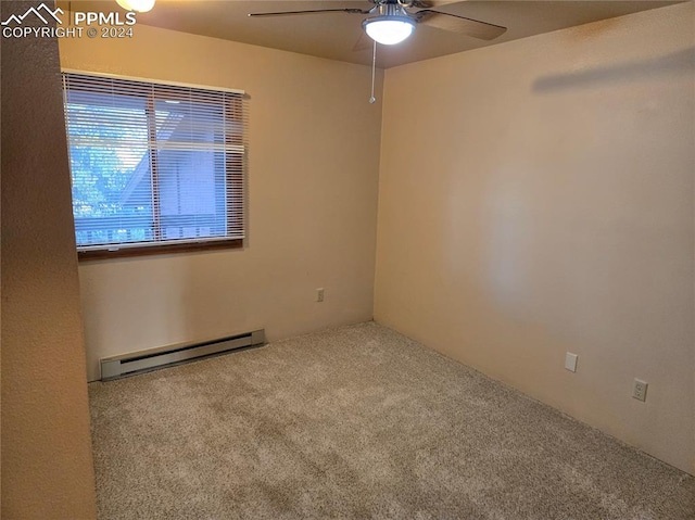 carpeted empty room featuring ceiling fan and a baseboard radiator