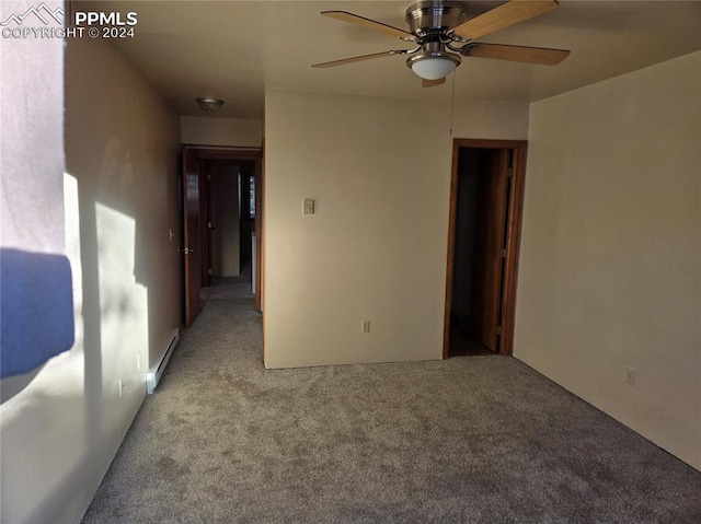 carpeted empty room featuring ceiling fan and a baseboard radiator