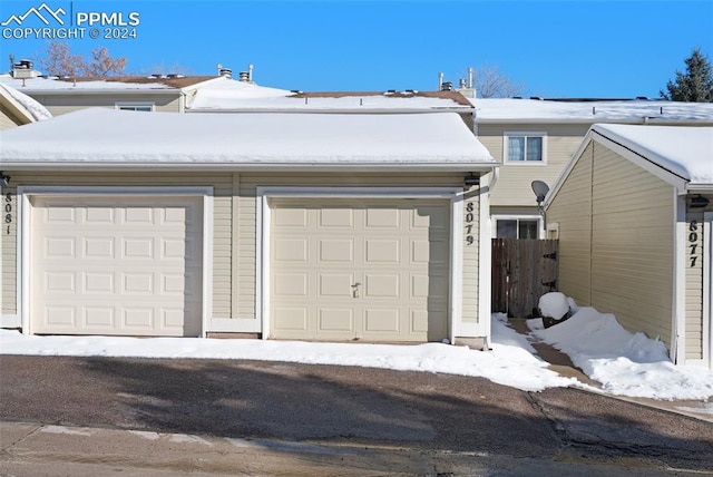 view of snow covered garage