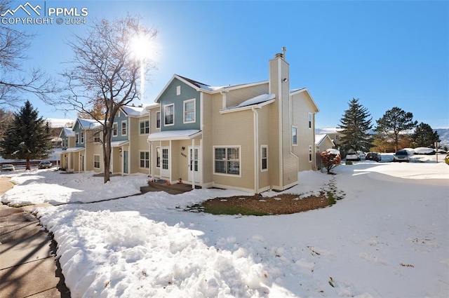 view of snow covered house