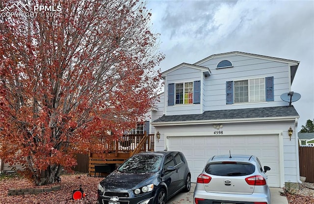 view of front of home featuring a garage and a deck