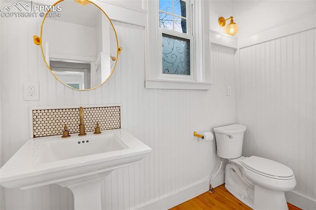 bathroom featuring toilet and hardwood / wood-style flooring