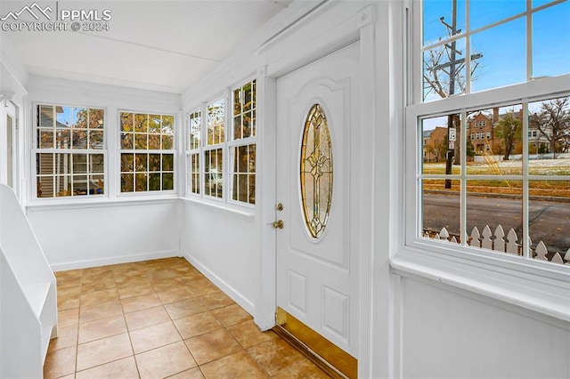 unfurnished sunroom featuring a wealth of natural light