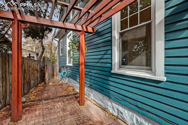 view of property exterior with a pergola