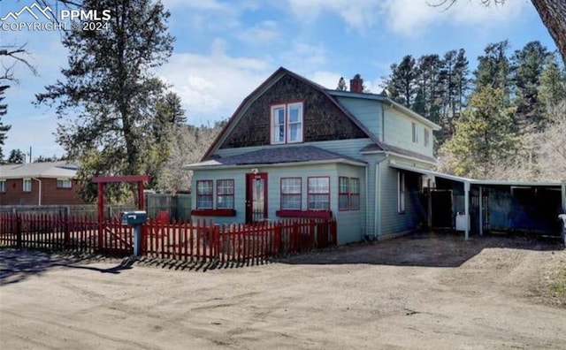 view of front of home featuring a carport