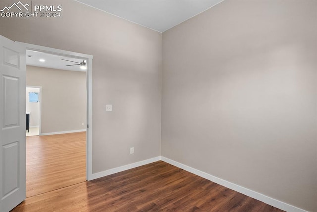 spare room with hardwood / wood-style floors and ceiling fan