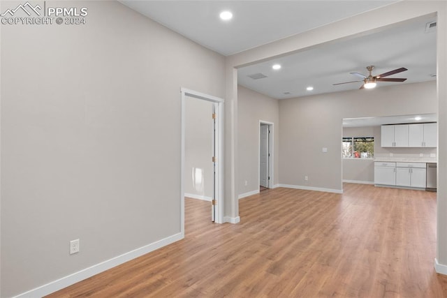 unfurnished living room featuring light hardwood / wood-style flooring and ceiling fan