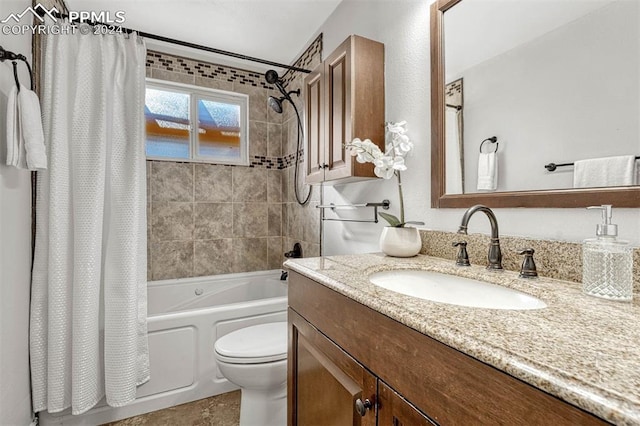 full bathroom with shower / bath combo, vanity, and toilet