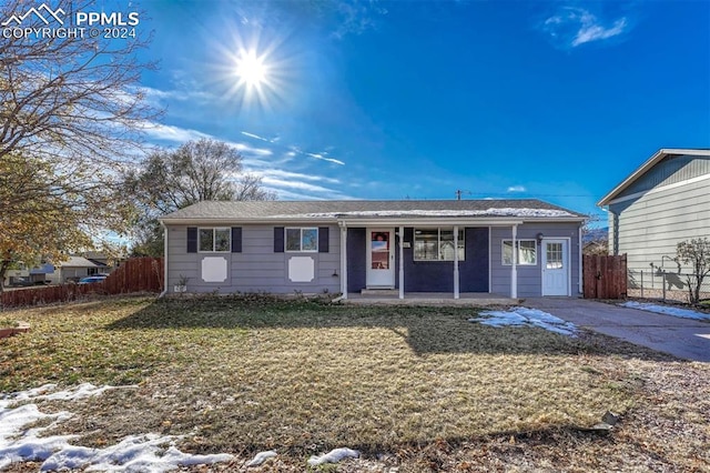 ranch-style home with a front lawn