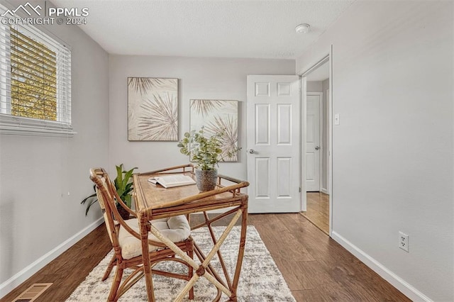 office area with hardwood / wood-style floors