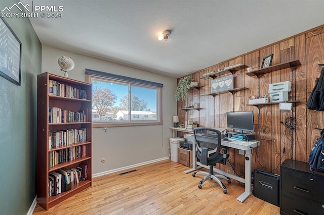 office space with light hardwood / wood-style floors