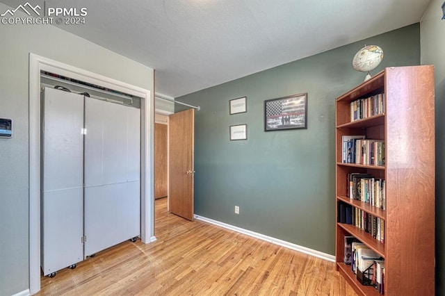 bedroom featuring light hardwood / wood-style flooring and a closet