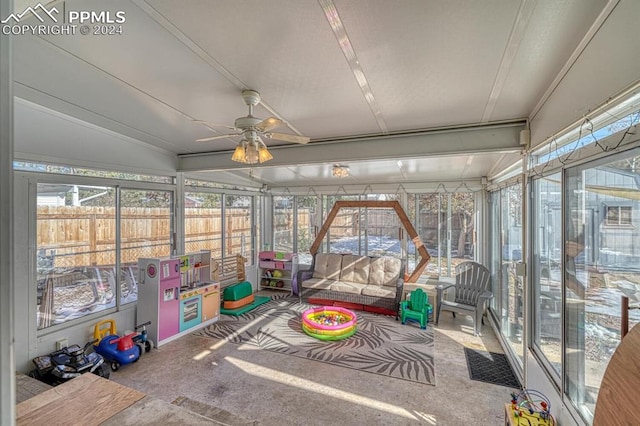 sunroom / solarium featuring lofted ceiling and ceiling fan