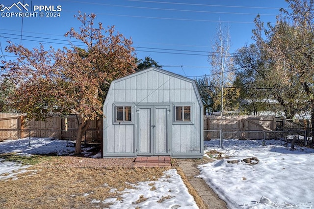 1511 N Chelton Rd, Colorado Springs, CO 80909 - snow covered structure featuring a fenced backyard and a shed