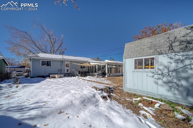 view of snow covered house