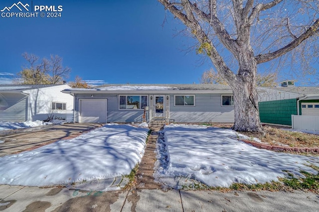1511 N Chelton Rd, Colorado Springs, CO 80909 - ranch-style house featuring an attached garage