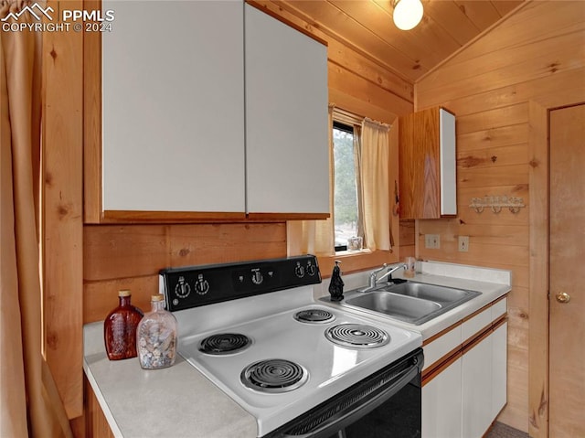 kitchen with white electric range oven, wood walls, white cabinetry, sink, and lofted ceiling