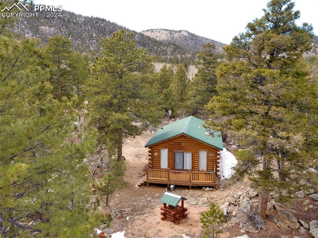 exterior space featuring a deck with mountain view