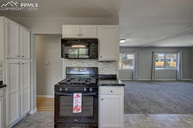 kitchen with light colored carpet, decorative backsplash, black appliances, a textured ceiling, and white cabinetry