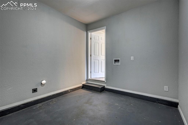 empty room with a textured ceiling