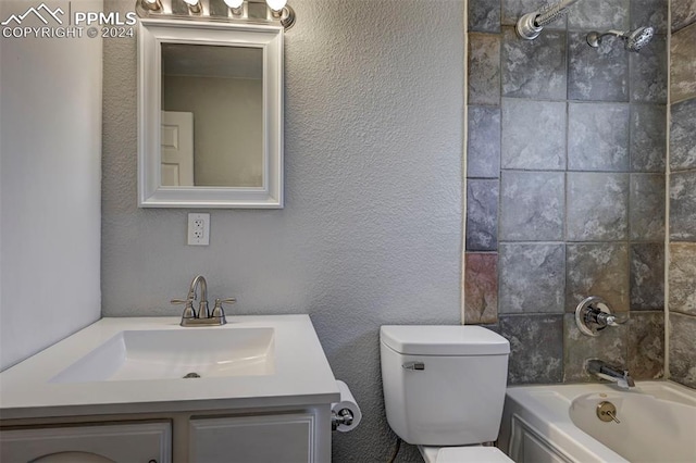 full bathroom featuring toilet, tiled shower / bath combo, and vanity