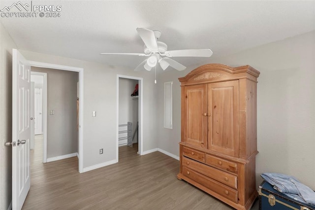 bedroom with hardwood / wood-style flooring and ceiling fan