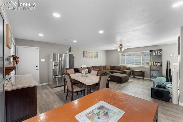 dining area featuring ceiling fan and hardwood / wood-style floors