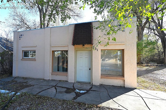 entrance to property with a patio