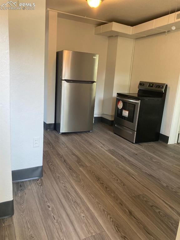 kitchen featuring dark hardwood / wood-style floors and appliances with stainless steel finishes