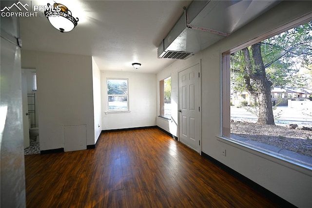 entryway with dark hardwood / wood-style floors